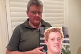 James Smith holds a picture of his son Chris who was killed in a car accident in 2013.