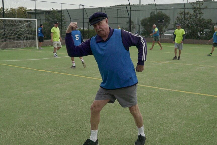 75-year-old Tommy Hill strikes a pose during a game of walking football.