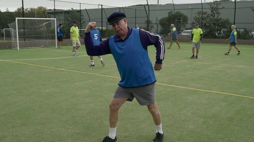 75-year-old Tommy Hill strikes a pose during a game of walking football