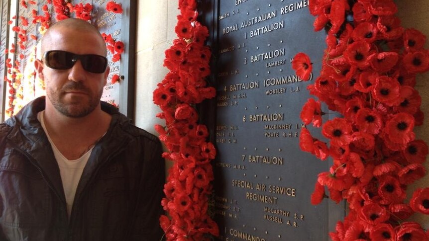 A man by a memorial