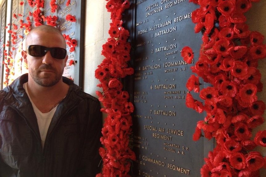 A man by a memorial