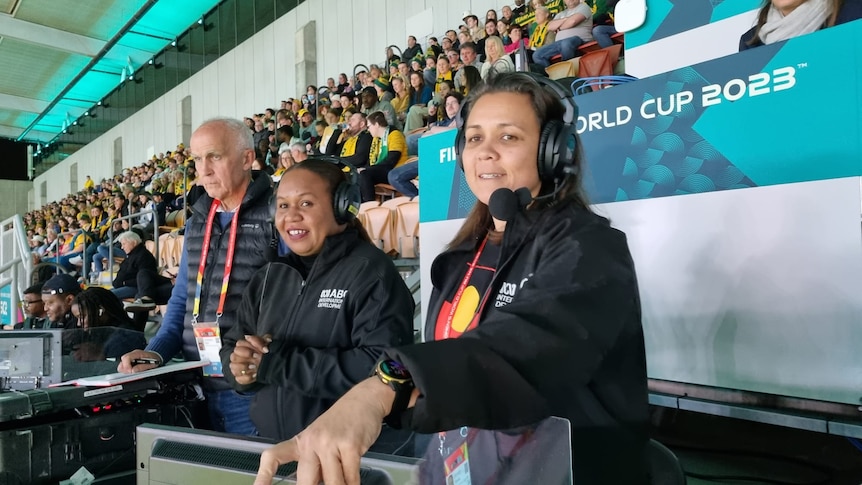 A women in a commentator box at the FIFA world cup