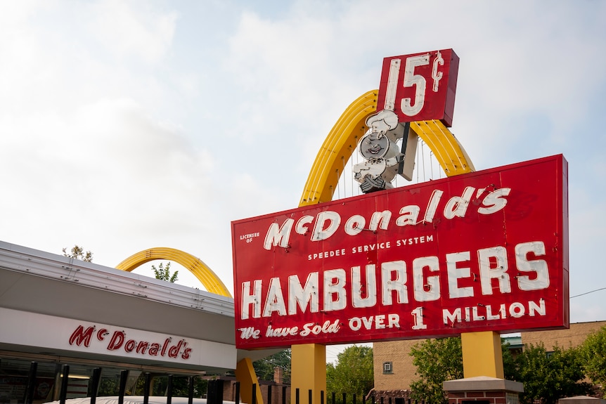 An old McDonald's restaurant with the signature golden arches. The sign says "Hamburgers: We have sold over 1 million"