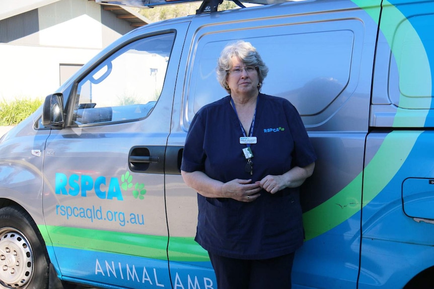 Ms Collecott stands in front of one the RSPCA's rescue vans.