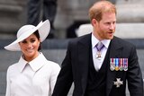 Megan and Prince Harry leave a cathedral in London.