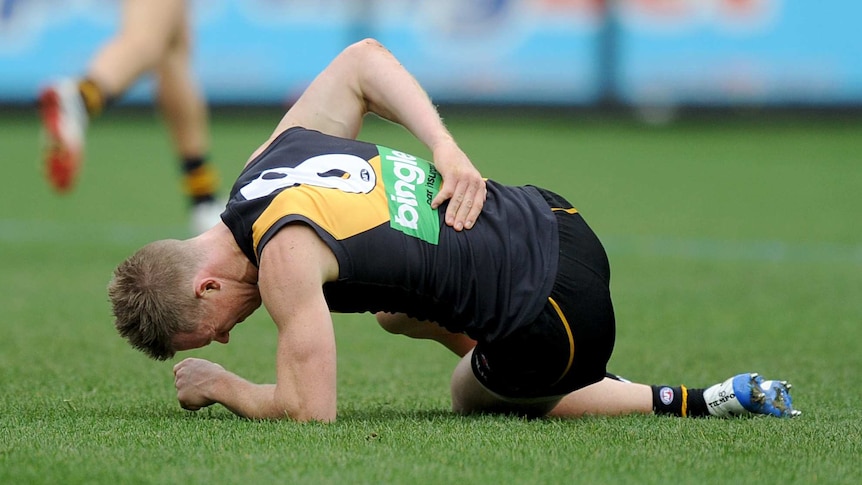 Riewoldt lies on the ground in pain