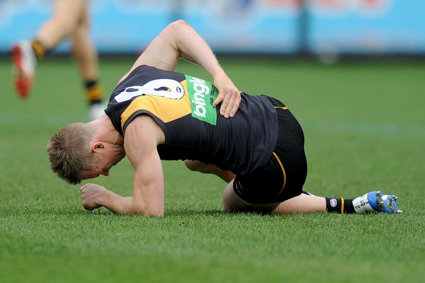 Riewoldt lies on the ground in pain