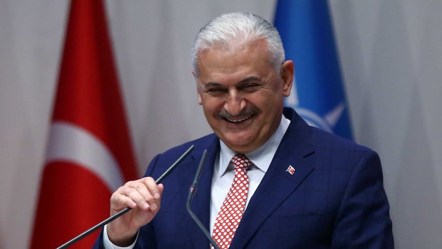 Binali Yildirim delivers a speech during a press conference.