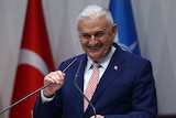 Binali Yildirim delivers a speech during a press conference.