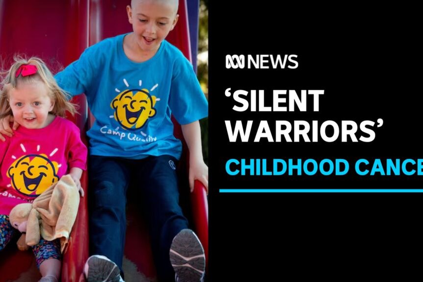 'Silent Warriors' Childhood Cancer: Two children slide down a a pair of playground slides together.