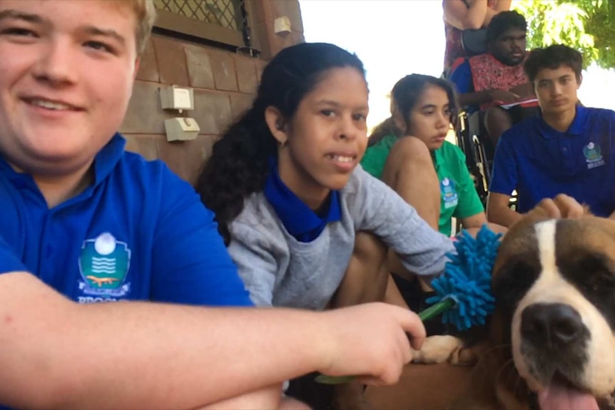 Special education needs students with their companion dog.