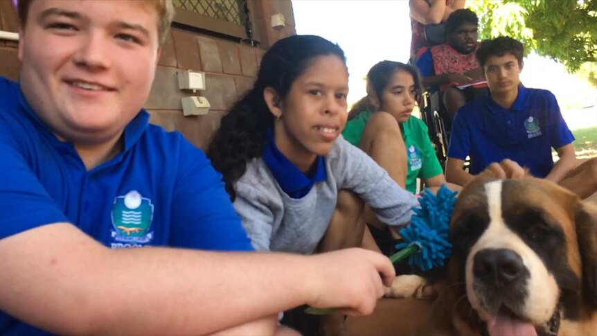 Special education needs students with their companion dog.