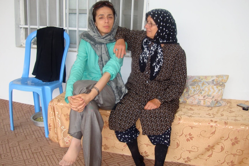 Masih with her mother in 2009.