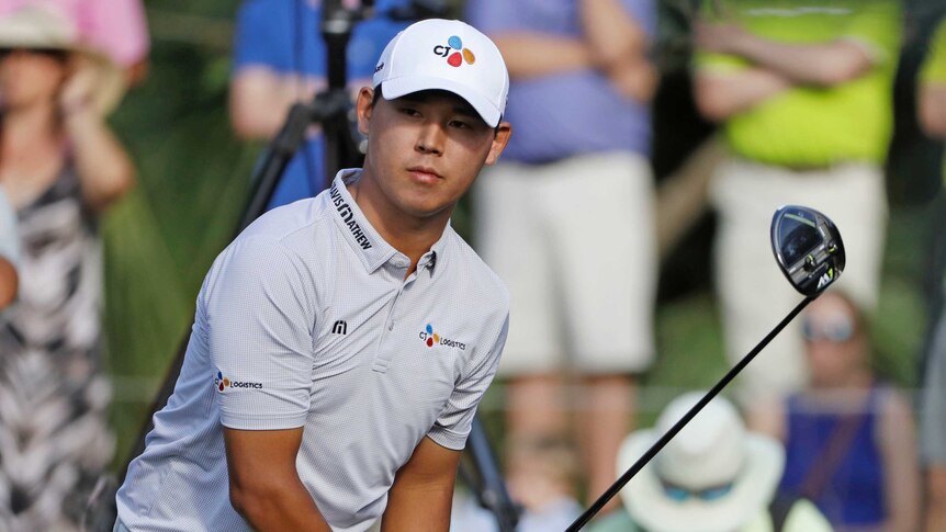 Kim Si-woo watches his shot at Players Championship