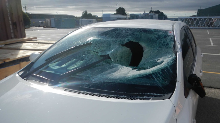 A car with a smashed windshield