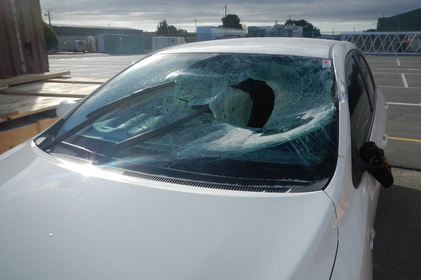 A car with a smashed windshield