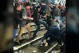 An image from social media shows fans clashing on the terrace at Kardinia Park following the Geelong-Melbourne match.