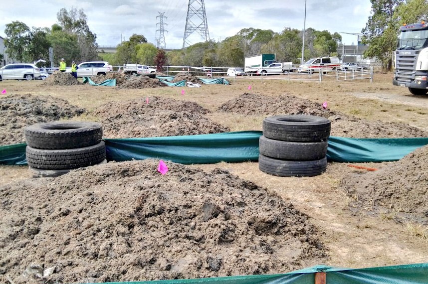 Piles of dirt dug up from a site at Carole Park in search for Sharron Phillips' remains
