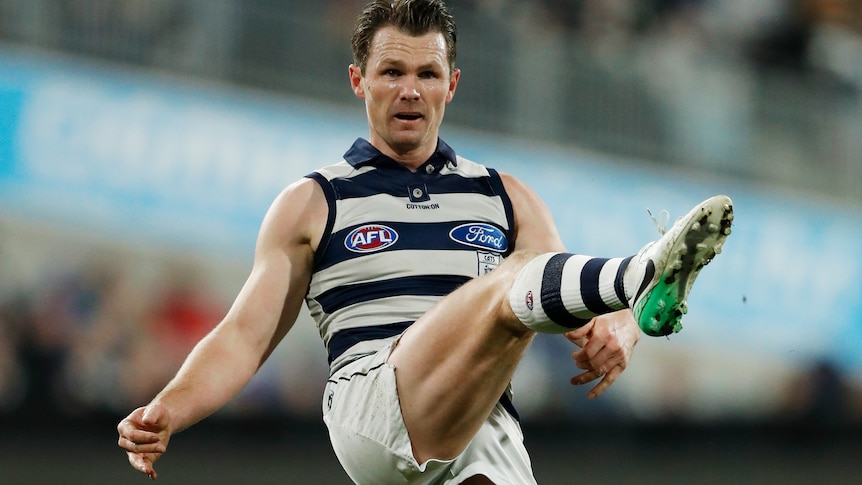 Patrick Dangerfield concentrates as he kicks the football
