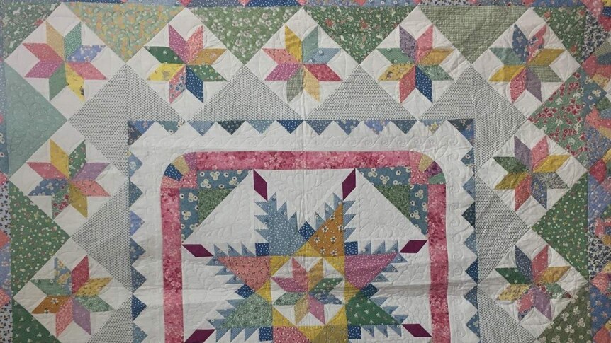 Colourful geometric patchwork quilt