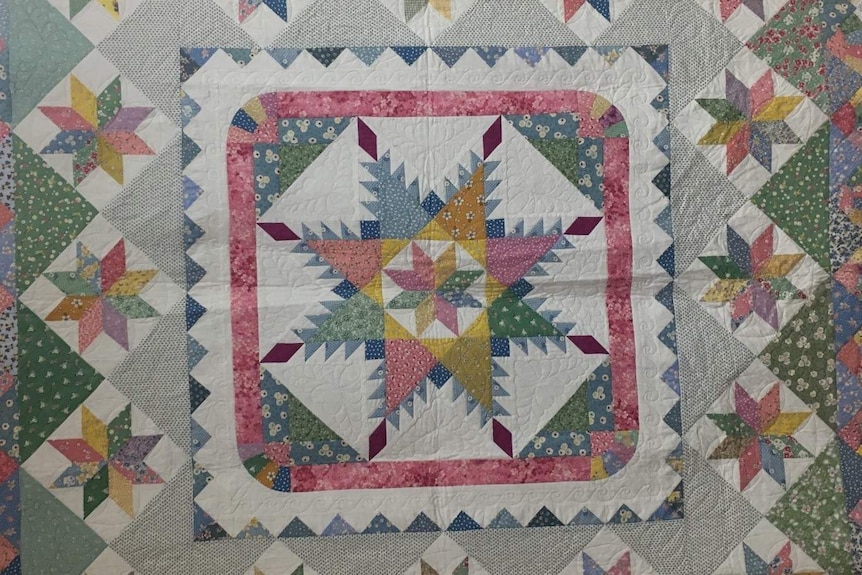 Colourful geometric patchwork quilt