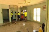 Workers refurbish a house