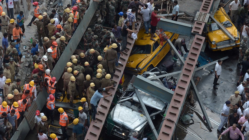 Indian rescue workers try to rescue people