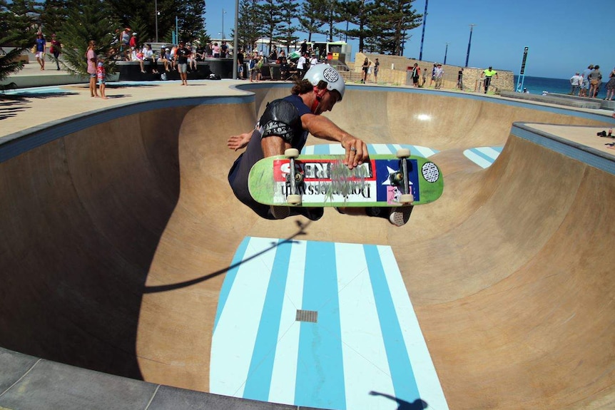 A skateboarder does a trick at the Scarborough Beach park.