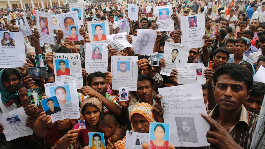 Relatives show pictures of missing Bangladesh workers