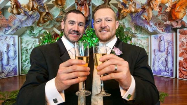 Speers Point's Paul McCarthy (left) and Trent Kandler pose after being married in Wellington, New Zealand.