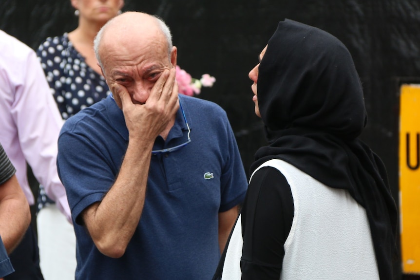 Saeed Maasarwe wipes tears from his eyes.