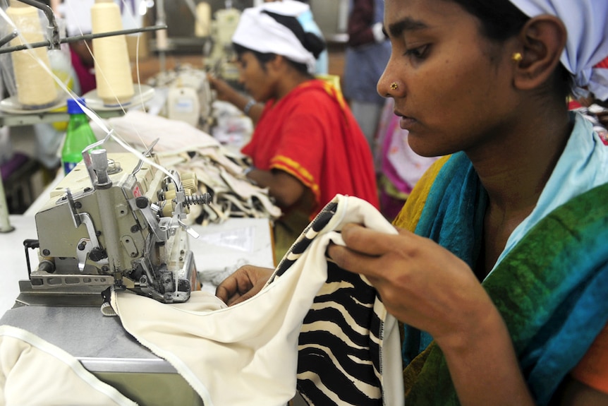 Bangladeshi women work in a garments factory in Dhaka in, 2012.