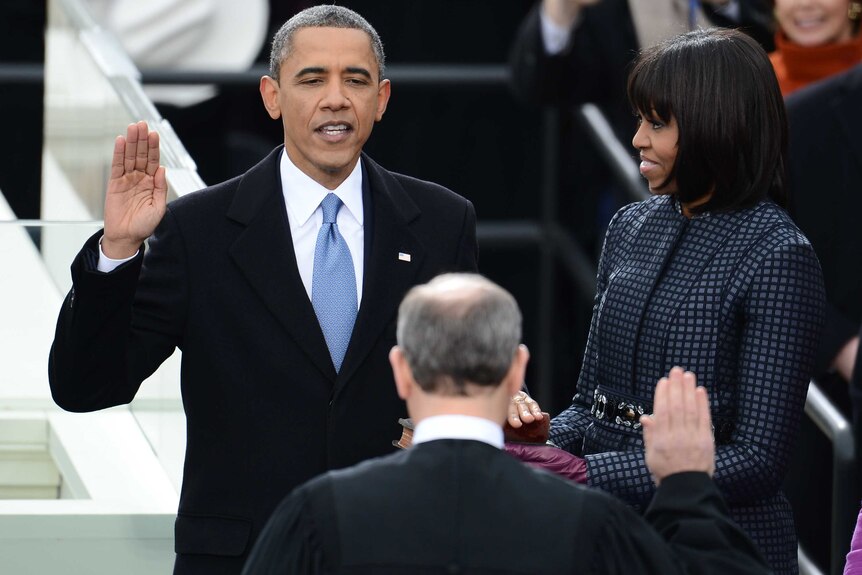 Barack Obama takes the oath of office.