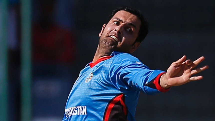 Aghanistan's Mohammad Nabi bowls against England at the World Twenty20