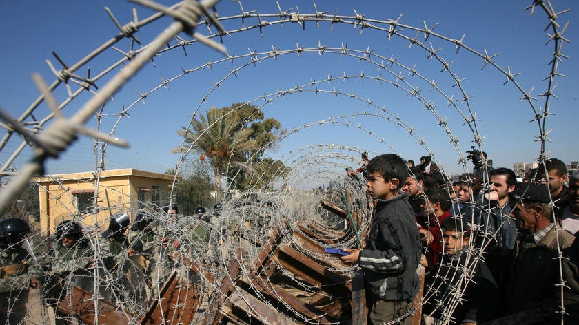 Egyptian forces used barbed wire and metal barricades to seal the only remaining gap on the Egyptian side of the frontier at Rafah, a town straddling the border.