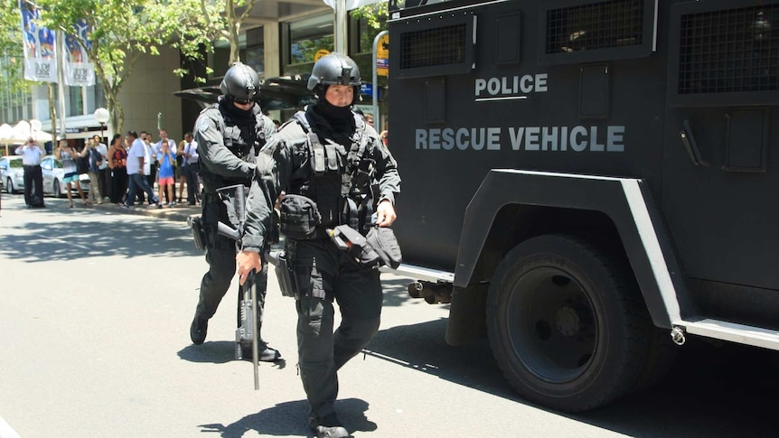 Armed police gather outside NSW Parliament on December 20, 2013