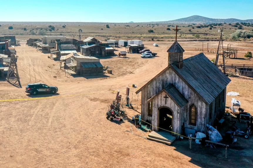 An aerial view of an empty Western film set depicting an old town and church