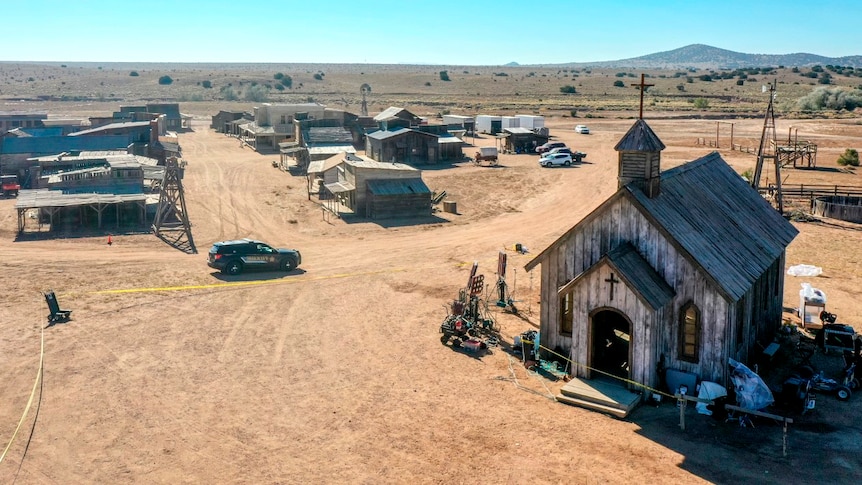 An aerial view of an empty Western film set depicting an old town and church