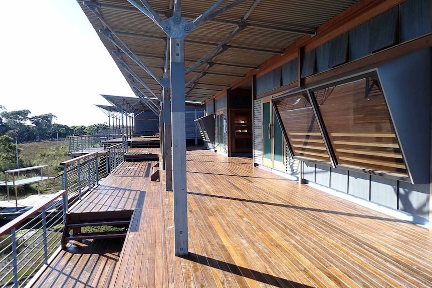 A long building with a timber deck