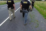 Australian Border Force officers conduct a raid on a Victorian farm.