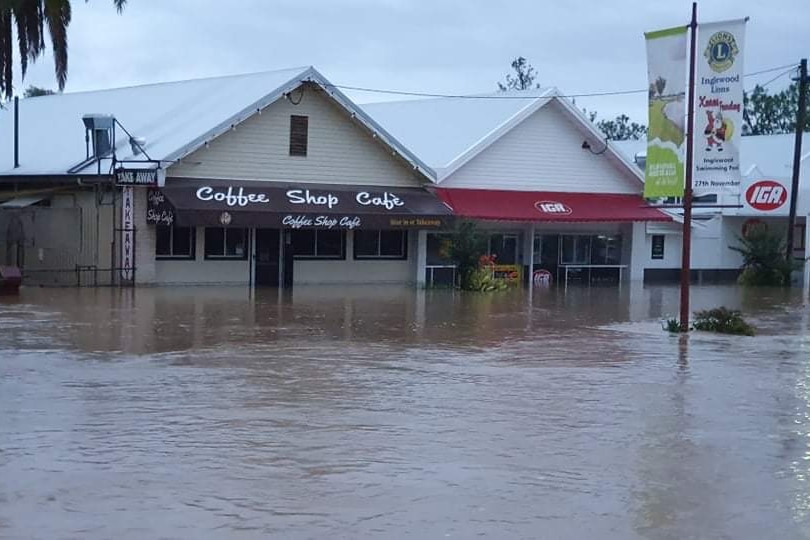 The coffee shop and IGA surrounded by floodwater.
