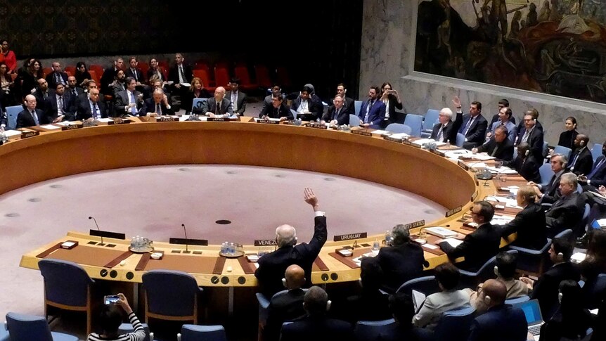 Russian Ambassador Vitaly Churkin vetoes a resolution on Syria at the UN.