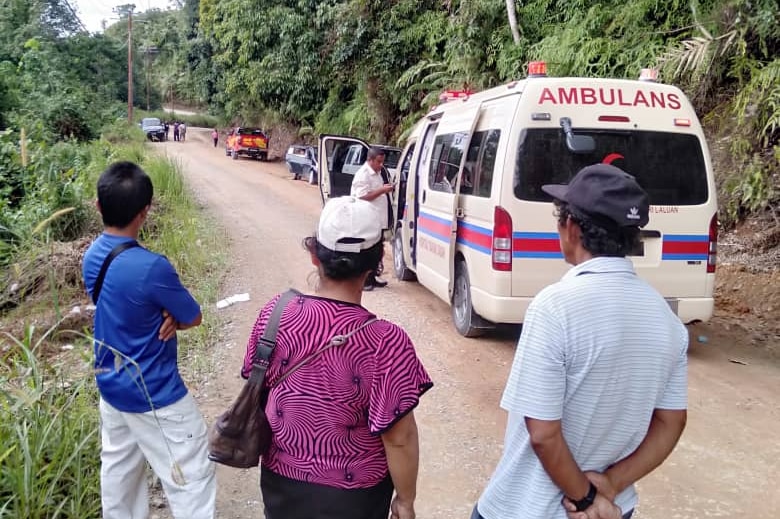 An ambulance on the side of the road in a small village in Borneo.