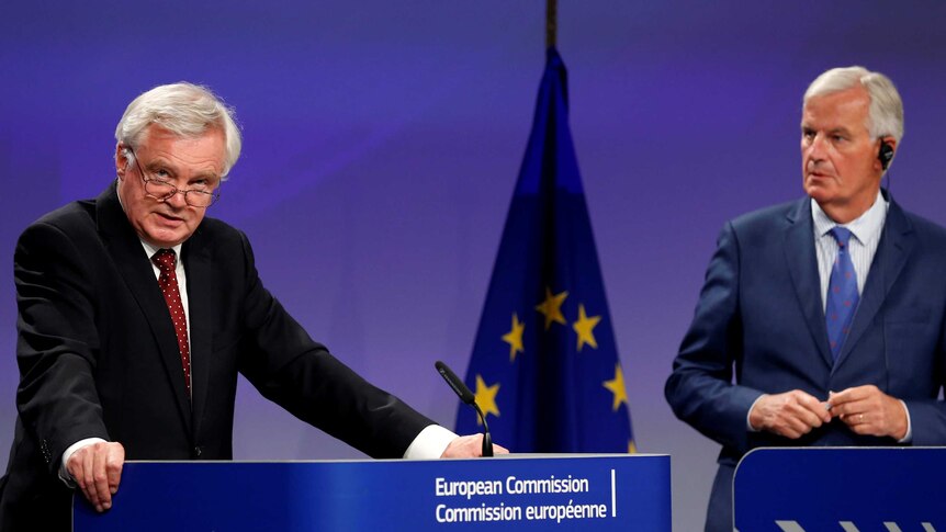 Britain's Brexit minister and the EU chief negotiator hold a joint press conference.