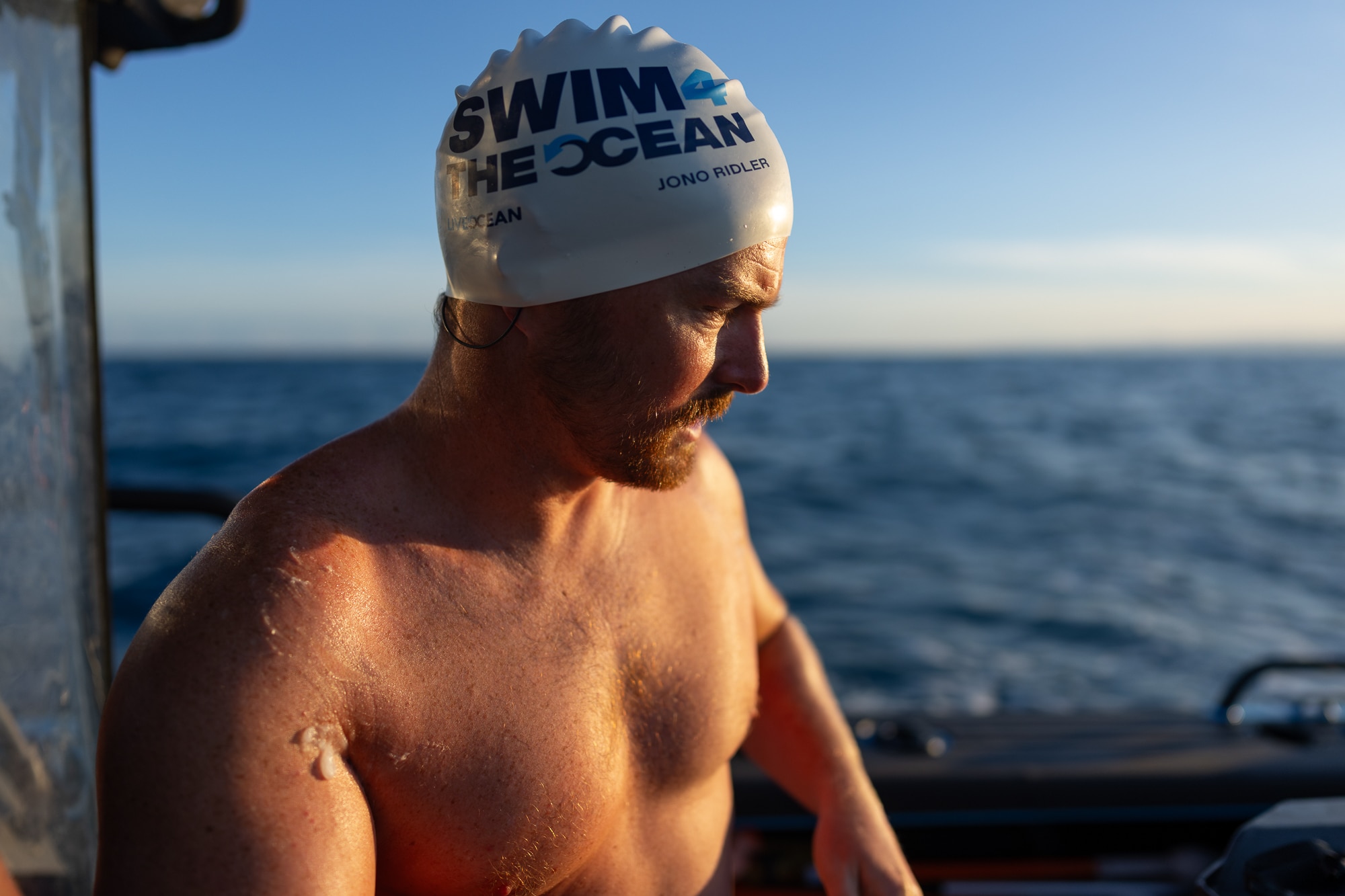 Jono Ridler looks out from the boat