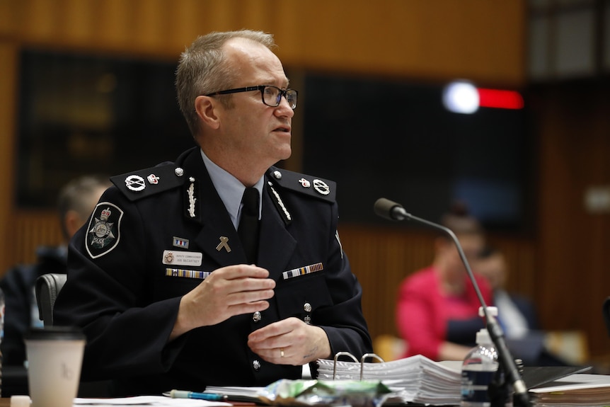 Ian McCartney in police uniform speaks at Senate Estimates in May 2021.