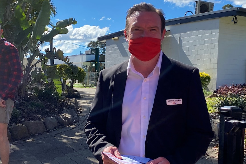 James Martin, wearing a face mask, outside a polling booth in Stretton.