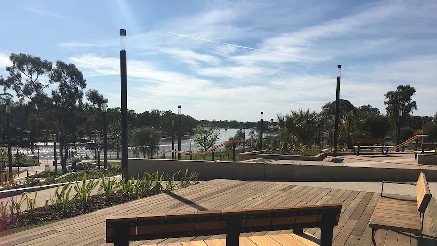 View of Murray River from chairs on a deck, part of tiered steps and ramps.