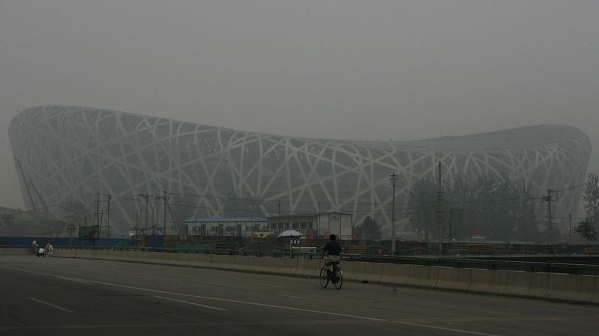 The Beijing National Stadium, nicknamed the Birds Nest, is lost in the haze on July 26, 2007 in China.