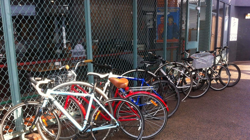 Bicycles locked up in walkway